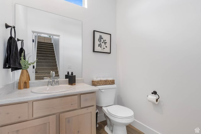 606 W Caroles Way, Tooele, UT 84074 - bathroom featuring toilet, vanity, and wood finished floors