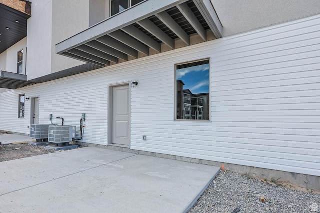 606 W Caroles Way, Tooele, UT 84074 - entrance to property with central air condition unit and a patio area