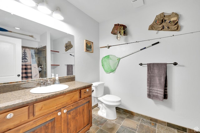 14789 S Briar Park Rd W, Herriman, UT 84096 - full bathroom featuring stone tile flooring, vanity, toilet, baseboards, and curtained shower