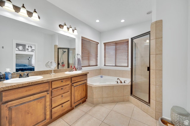 14789 S Briar Park Rd W, Herriman, UT 84096 - ensuite bathroom with tile patterned floors, a garden tub, a shower stall, double vanity, and recessed lighting