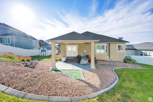 14789 S Briar Park Rd W, Herriman, UT 84096 - back of property featuring french doors, a patio area, stucco siding, and roof with shingles