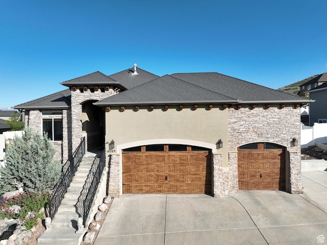 14789 S Briar Park Rd W, Herriman, UT 84096 - french provincial home featuring stone siding, concrete driveway, stucco siding, and a garage