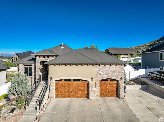 14789 S Briar Park Rd W, Herriman, UT 84096 - french country home featuring stone siding, concrete driveway, a garage, and stucco siding