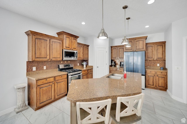 14789 S Briar Park Rd W, Herriman, UT 84096 - kitchen featuring appliances with stainless steel finishes, a sink, backsplash, brown cabinetry, and recessed lighting