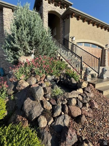 14789 S Briar Park Rd W, Herriman, UT 84096 - view of side of home featuring stucco siding and stone siding