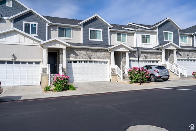 14508 S Juniper Shade Dr W, Herriman, UT 84096 - multi unit property featuring stone siding, driveway, board and batten siding, and a garage