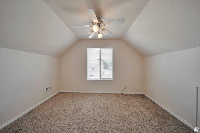1588 N Dawson W, Tooele, UT 84074 - bonus room featuring vaulted ceiling, carpet, ceiling fan, baseboards, and a textured ceiling