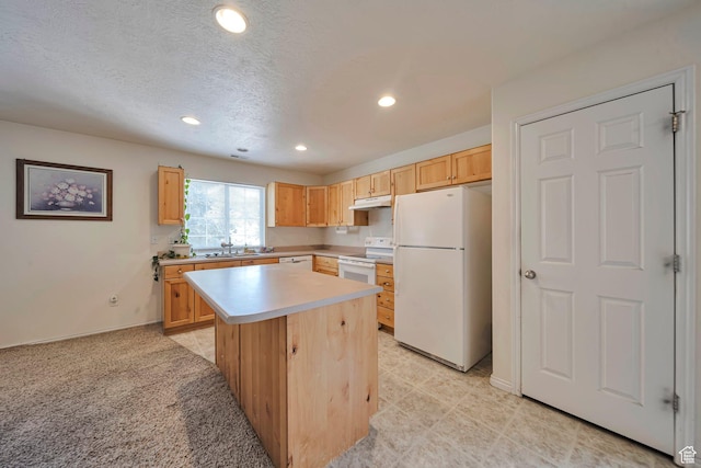1588 N Dawson W, Tooele, UT 84074 - kitchen featuring white appliances, light brown cabinetry, under cabinet range hood, light countertops, and recessed lighting