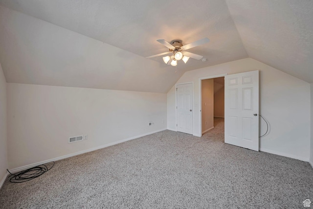 1588 N Dawson W, Tooele, UT 84074 - additional living space with lofted ceiling, light colored carpet, baseboards, and a ceiling fan