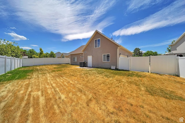 1588 N Dawson W, Tooele, UT 84074 - back of house with central AC and a garage