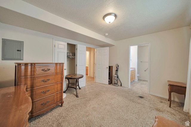 1588 N Dawson W, Tooele, UT 84074 - bedroom with electric panel, baseboards, carpet floors, a textured ceiling, and ensuite bath