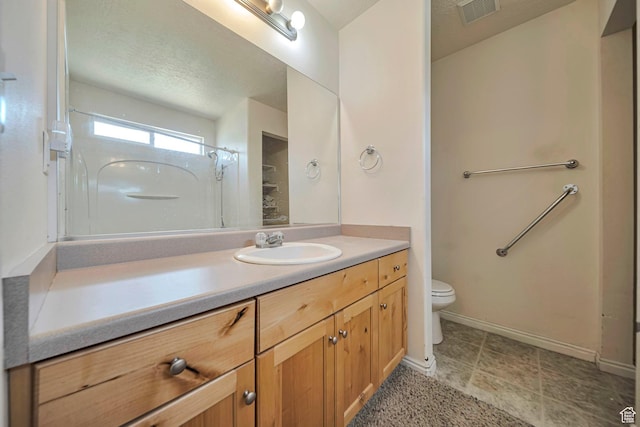 1588 N Dawson W, Tooele, UT 84074 - full bathroom with vanity, toilet, a shower, and baseboards
