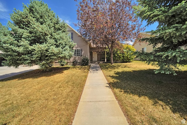 1588 N Dawson W, Tooele, UT 84074 - view of property hidden behind natural elements featuring a front yard