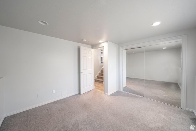 1454 N 420 E, Tooele, UT 84074 - unfurnished bedroom featuring carpet flooring, recessed lighting, a closet, and baseboards