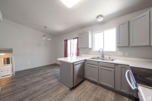 1454 N 420 E, Tooele, UT 84074 - kitchen with a sink, appliances with stainless steel finishes, gray cabinets, a peninsula, and wood finished floors