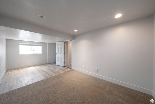 1454 N 420 E, Tooele, UT 84074 - empty room featuring recessed lighting, baseboards, light wood-style flooring, and light colored carpet