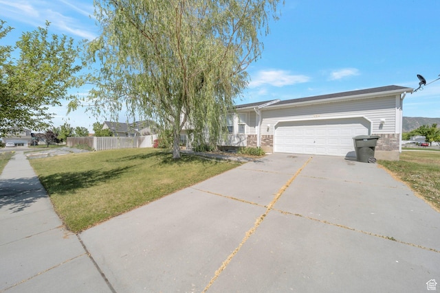 1454 N 420 E, Tooele, UT 84074 - ranch-style house with an attached garage, driveway, and brick siding