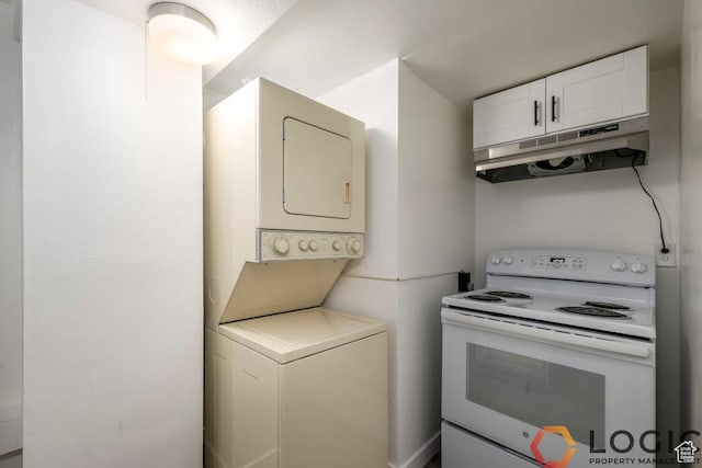 2743 Liberty Ave, Ogden, UT 84403 - kitchen with white range with electric cooktop, estacked washer and dryer, under cabinet range hood, white cabinets, and light countertops