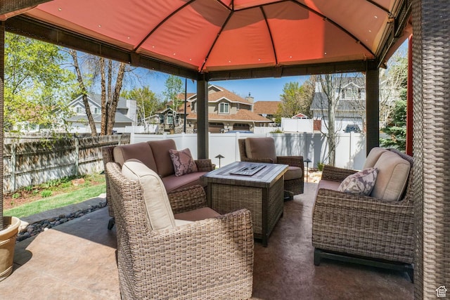 10128 S 2460 E, Sandy, UT 84092 - fenced backyard featuring an outdoor hangout area, a residential view, a gazebo, and a patio area
