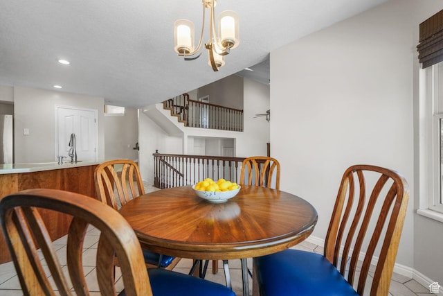 10128 S 2460 E, Sandy, UT 84092 - dining area featuring light tile patterned floors, baseboards, recessed lighting, a chandelier, and stairway