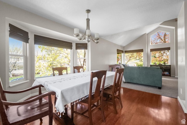 10128 S 2460 E, Sandy, UT 84092 - dining room featuring a chandelier, baseboards, wood finished floors, and lofted ceiling