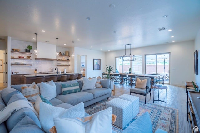 3780 Arcadia Dr Unit 53, Santa Clara, UT 84765 - living room featuring recessed lighting, light wood finished floors, and baseboards