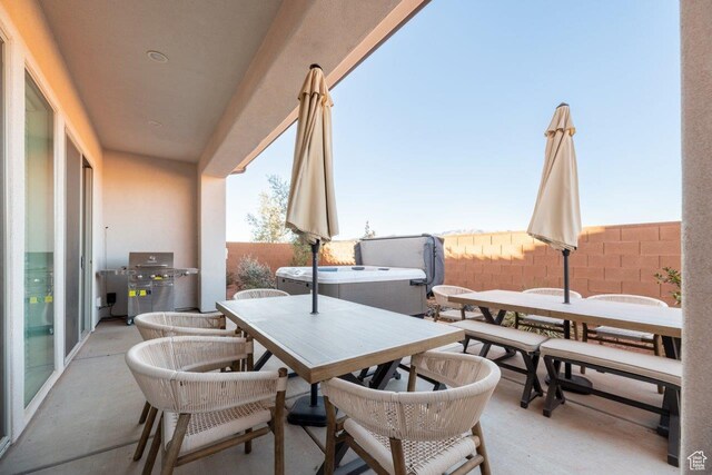 3780 Arcadia Dr Unit 53, Santa Clara, UT 84765 - fenced backyard featuring outdoor dining space, a grill, a hot tub, and a patio
