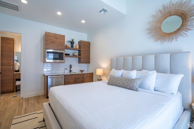 3780 Arcadia Dr Unit 53, Santa Clara, UT 84765 - bedroom with light wood-style floors, recessed lighting, a sink, and baseboards