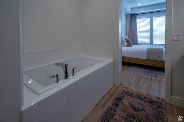 3780 Arcadia Dr Unit 53, Santa Clara, UT 84765 - ensuite bathroom featuring a garden tub and wood finished floors
