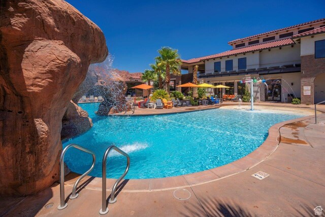 3780 Arcadia Dr Unit 53, Santa Clara, UT 84765 - community pool featuring a patio