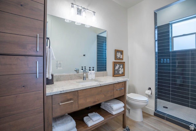 3780 Arcadia Dr Unit 53, Santa Clara, UT 84765 - bathroom with vanity, tiled shower, toilet, and wood finished floors