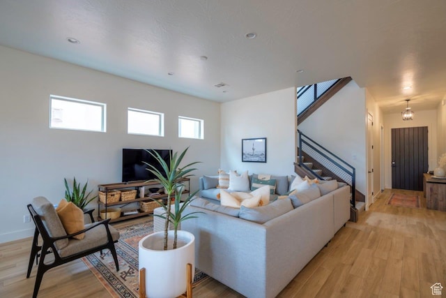 3780 Arcadia Dr Unit 53, Santa Clara, UT 84765 - living area featuring light wood-style flooring, stairs, and baseboards