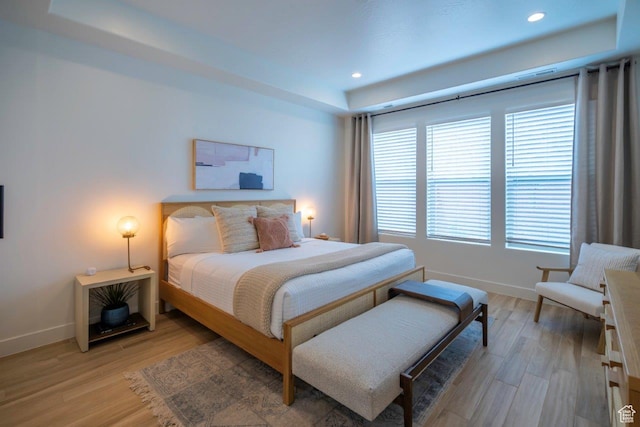 3780 Arcadia Dr Unit 53, Santa Clara, UT 84765 - bedroom featuring a raised ceiling, baseboards, light wood-type flooring, and recessed lighting
