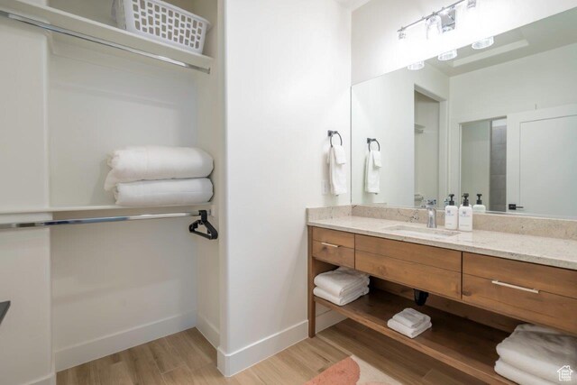 3780 Arcadia Dr Unit 53, Santa Clara, UT 84765 - bathroom with wood finished floors, vanity, and baseboards