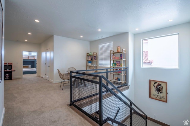 3780 Arcadia Dr Unit 53, Santa Clara, UT 84765 - hallway featuring an upstairs landing, baseboards, recessed lighting, and light carpet