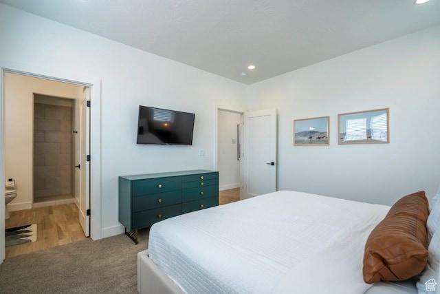3780 Arcadia Dr Unit 53, Santa Clara, UT 84765 - bedroom featuring recessed lighting, baseboards, light carpet, and ensuite bath