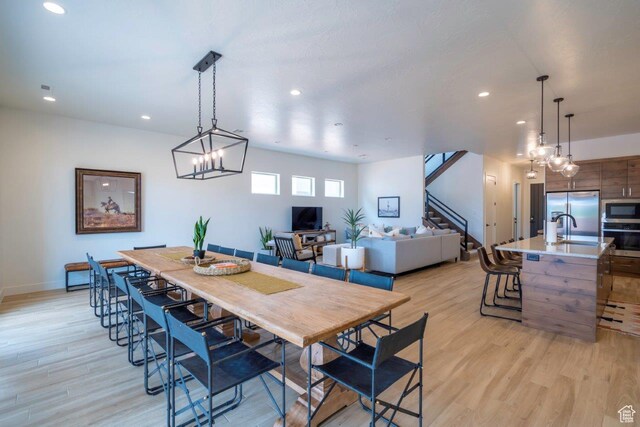3780 Arcadia Dr Unit 53, Santa Clara, UT 84765 - dining room with recessed lighting, light wood finished floors, stairs, and baseboards