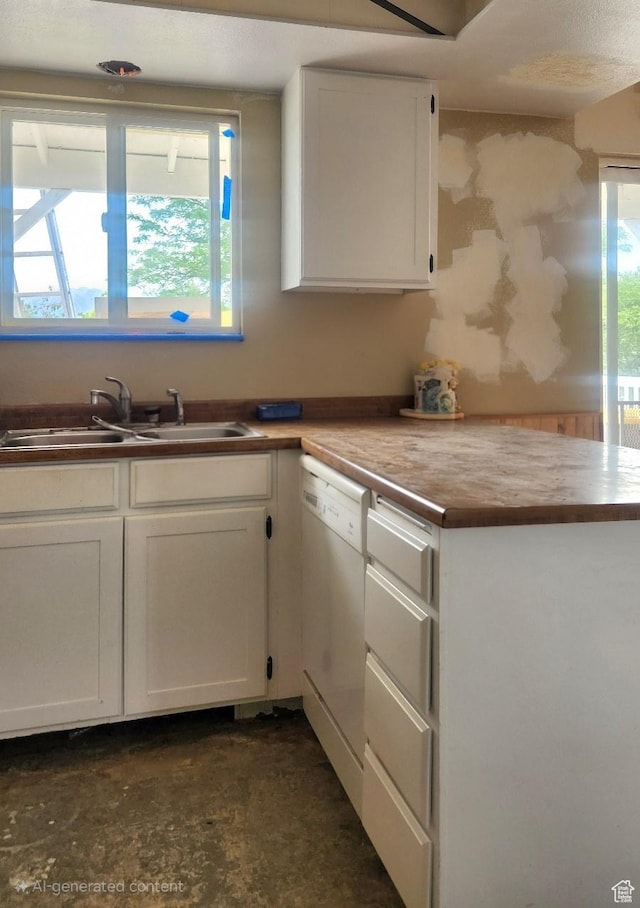5649 S Bree St W, Taylorsville, UT 84129 - kitchen with white dishwasher, a sink, white cabinets, and healthy amount of natural light