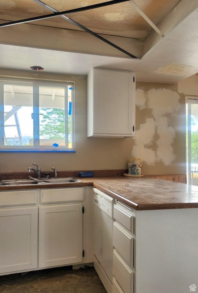 5649 S Bree St W, Taylorsville, UT 84129 - kitchen featuring white dishwasher, a sink, and white cabinetry