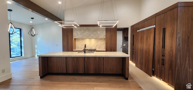 101 Crestview Cir, Park City, UT 84098 - kitchen featuring a sink, light countertops, light wood finished floors, a large island, and recessed lighting