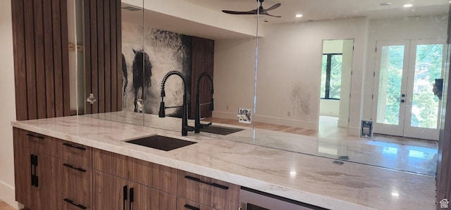 101 Crestview Cir, Park City, UT 84098 - kitchen with a sink, a ceiling fan, french doors, light stone countertops, and recessed lighting