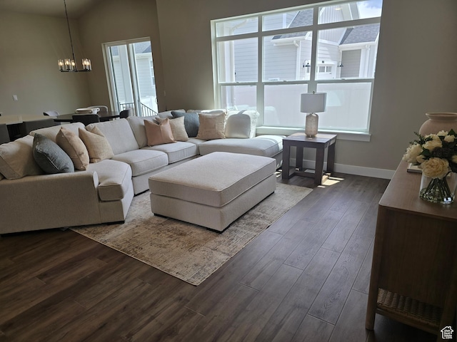 3577 W Haven Hollow Dr S, South Jordan, UT 84095 - living area with a chandelier, dark wood-type flooring, and baseboards