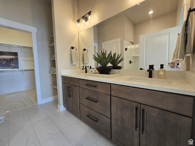 3577 W Haven Hollow Dr S, South Jordan, UT 84095 - full bath with marble finish floors, double vanity, a shower with door, a walk in closet, and built in shelves