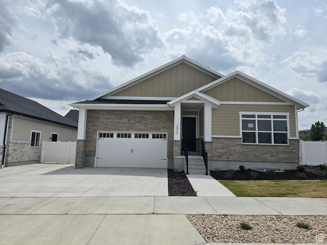 3577 W Haven Hollow Dr S, South Jordan, UT 84095 - craftsman house featuring concrete driveway, board and batten siding, an attached garage, and stone siding