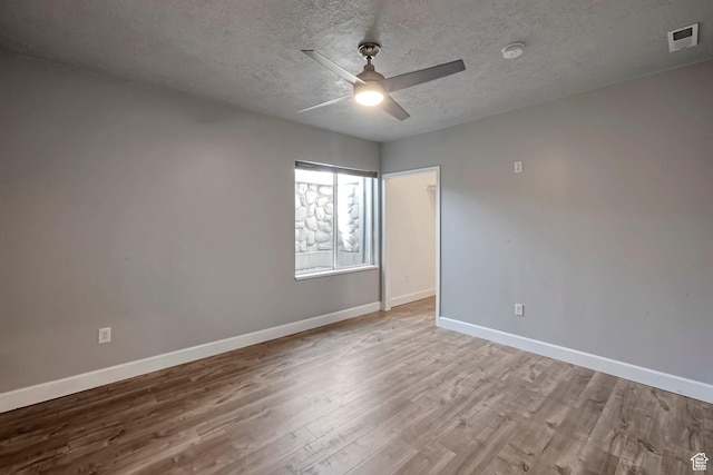 2832 N Turnberry Ln, Lehi, UT 84043 - empty room featuring wood finished floors, a textured ceiling, baseboards, and a ceiling fan