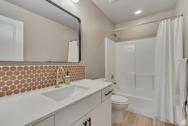 1791 W 60 S, Pleasant Grove, UT 84062 - bathroom featuring toilet, shower / tub combo, vanity, backsplash, and wood finished floors