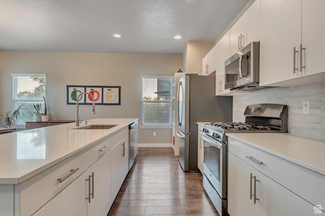 1791 W 60 S, Pleasant Grove, UT 84062 - kitchen featuring stainless steel appliances, a sink, light countertops, dark wood-style floors, and recessed lighting