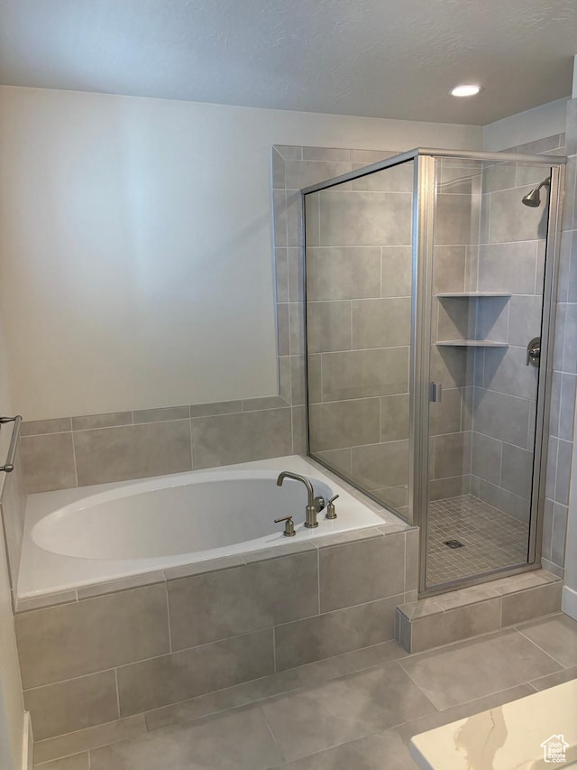 964 W Shadow Brook Ln, Lehi, UT 84043 - bathroom featuring a bath, a shower stall, and tile patterned flooring