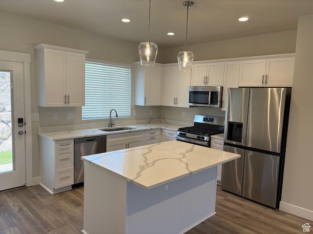 964 W Shadow Brook Ln, Lehi, UT 84043 - kitchen with appliances with stainless steel finishes, a sink, wood finished floors, white cabinets, and recessed lighting