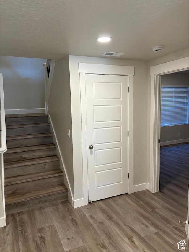 964 W Shadow Brook Ln, Lehi, UT 84043 - stairs with baseboards, wood finished floors, a textured ceiling, and recessed lighting